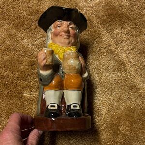 Vintage Ceramic Figurine with Black Hat and Orange Accents